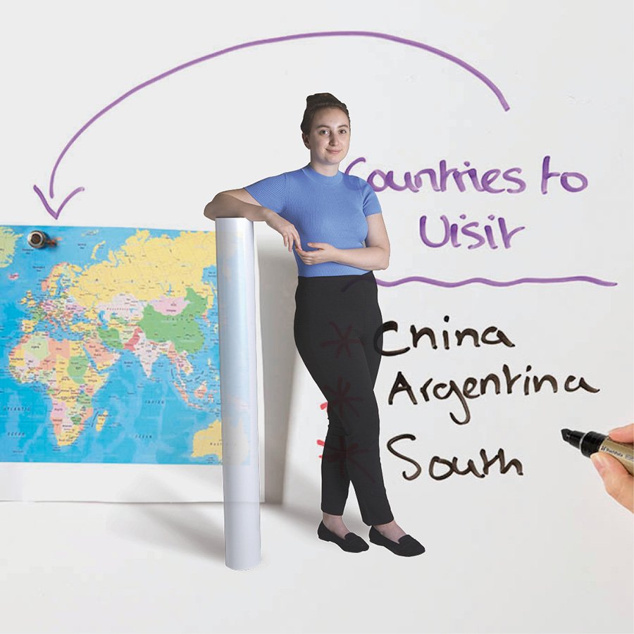 Woman presenting a Smart magnetic whiteboard wallpaper roll